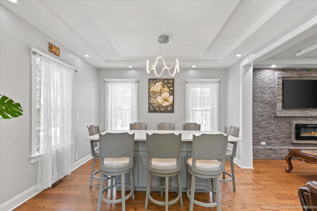 411 Herrick Road Riverside, IL 60546 - Photo 8 of 37 a view of a dining room with furniture window and wooden floor