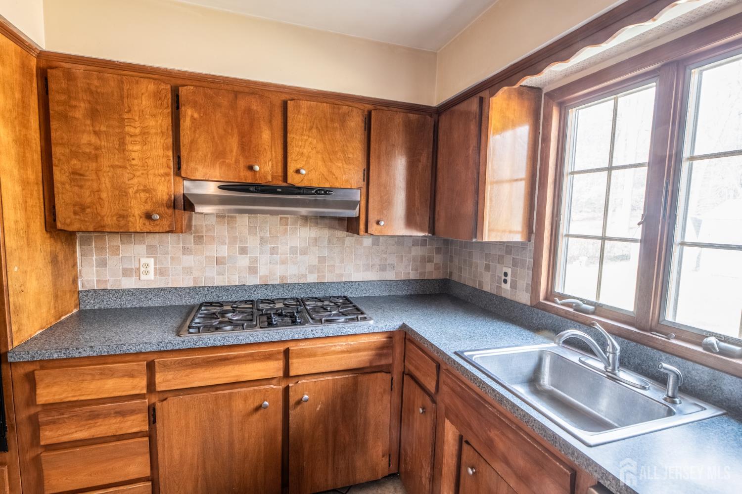 12 Francis Road East Brunswick, NJ 08816 - Photo 12 of 66 a kitchen with stainless steel appliances granite countertop a sink a stove and a refrigerator