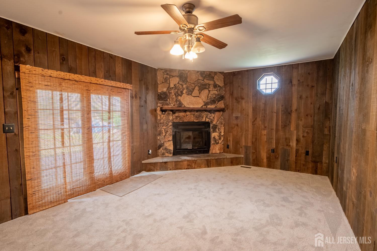 12 Francis Road East Brunswick, NJ 08816 - Photo 15 of 66 a view of an empty room with a fireplace and a window