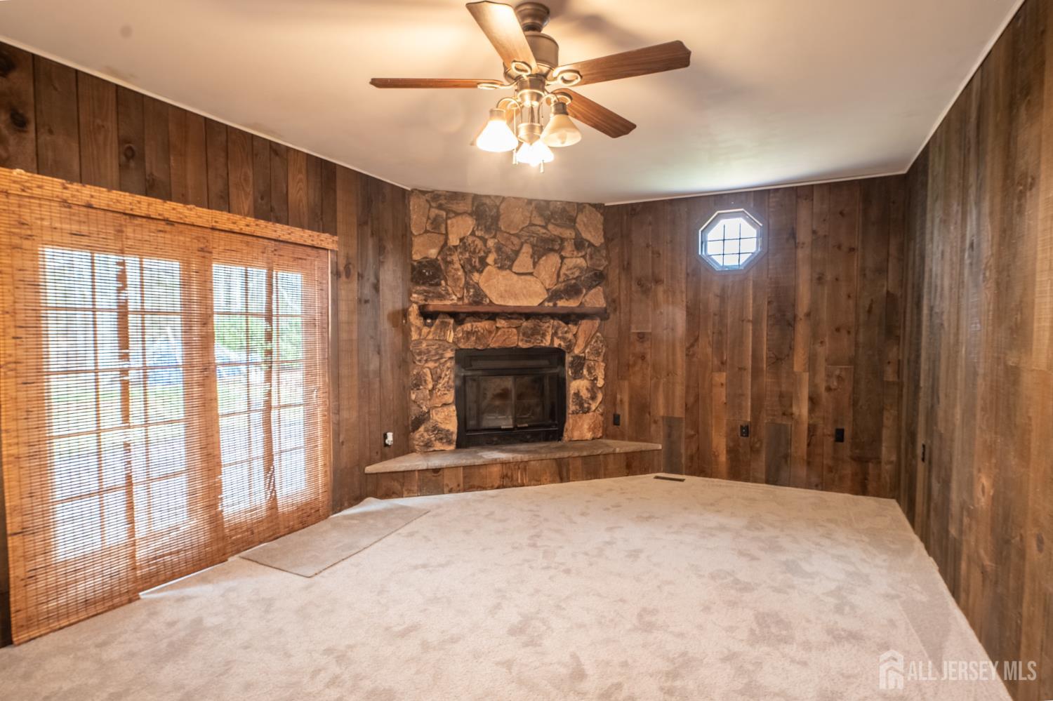 12 Francis Road East Brunswick, NJ 08816 - Photo 16 of 66 a view of an empty room with a fireplace and a window