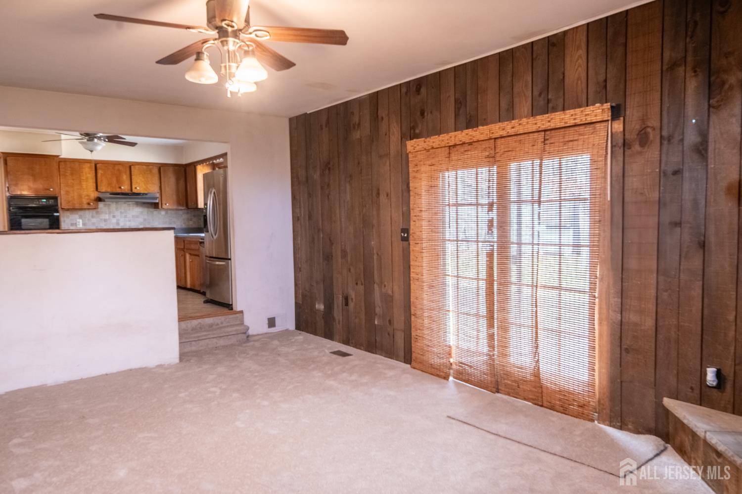 12 Francis Road East Brunswick, NJ 08816 - Photo 19 of 66 a view of an empty room with a window and a kitchen