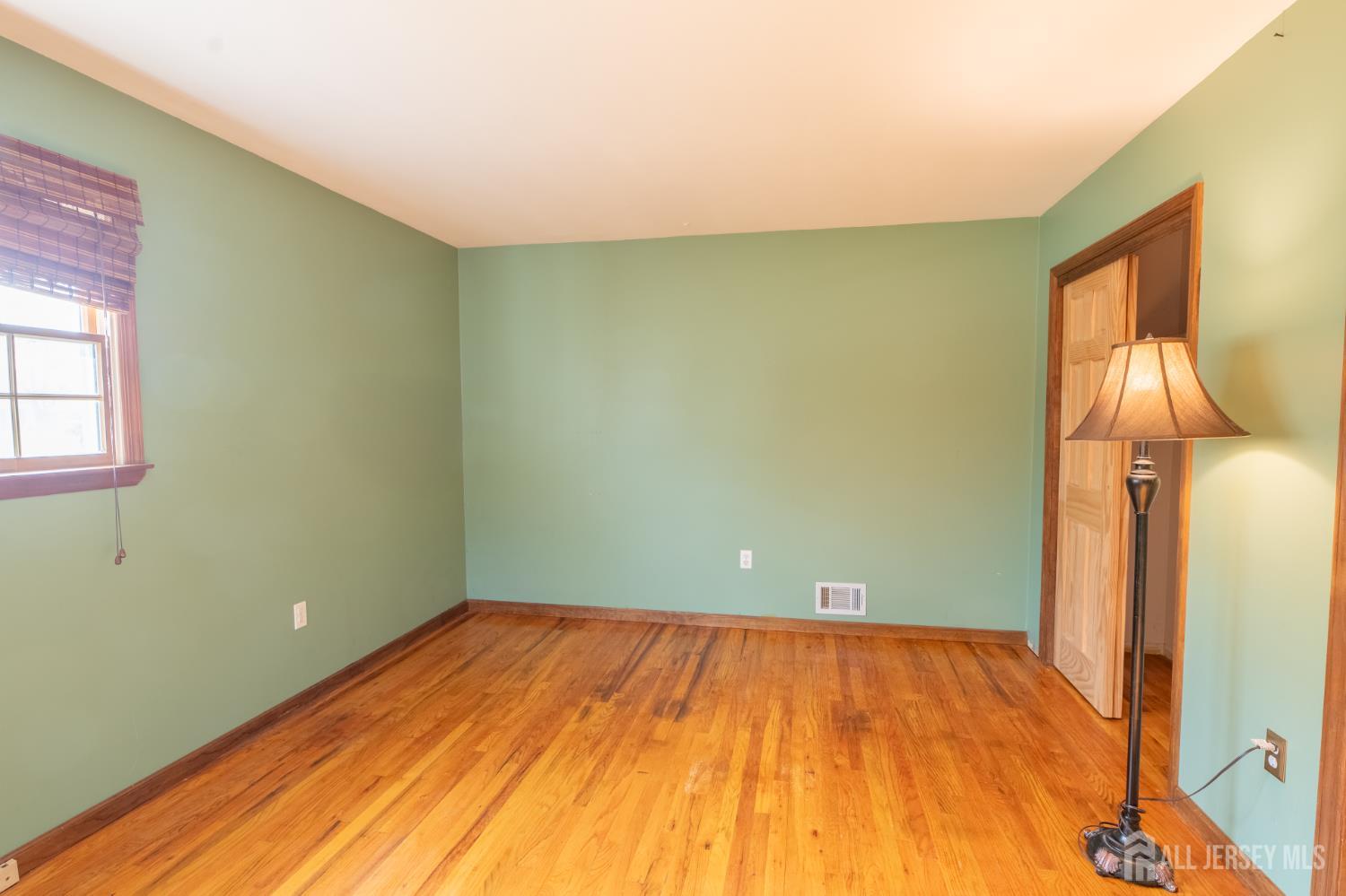 12 Francis Road East Brunswick, NJ 08816 - Photo 33 of 66 a view of empty room with wooden floor