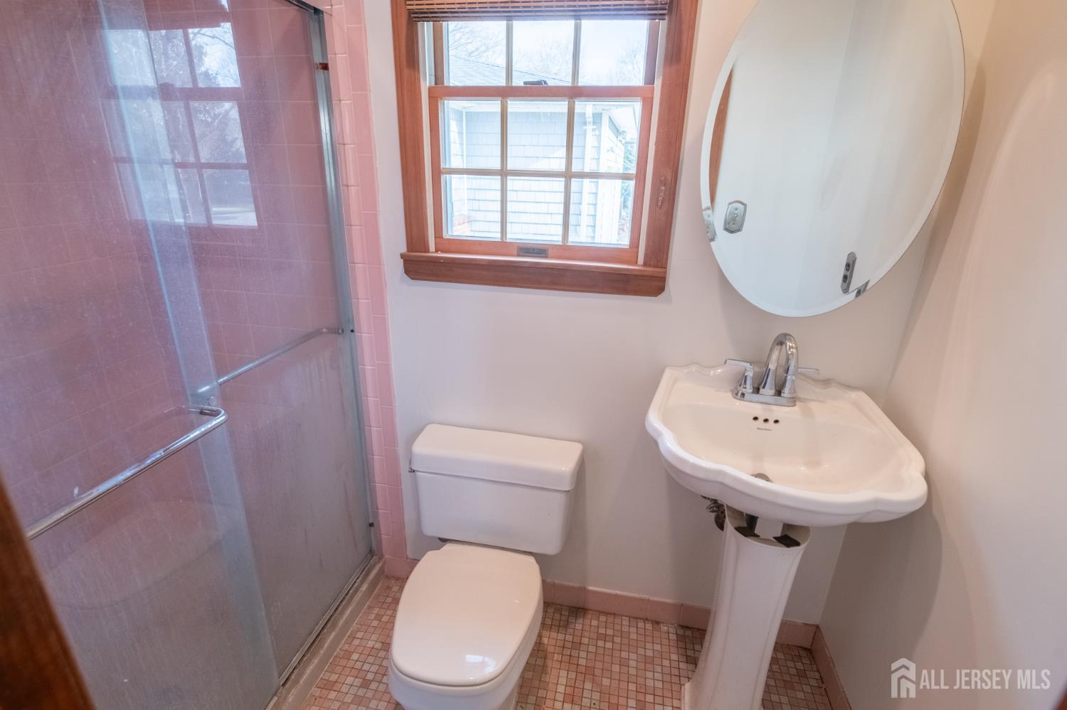 12 Francis Road East Brunswick, NJ 08816 - Photo 36 of 66 a bathroom with a toilet sink and mirror