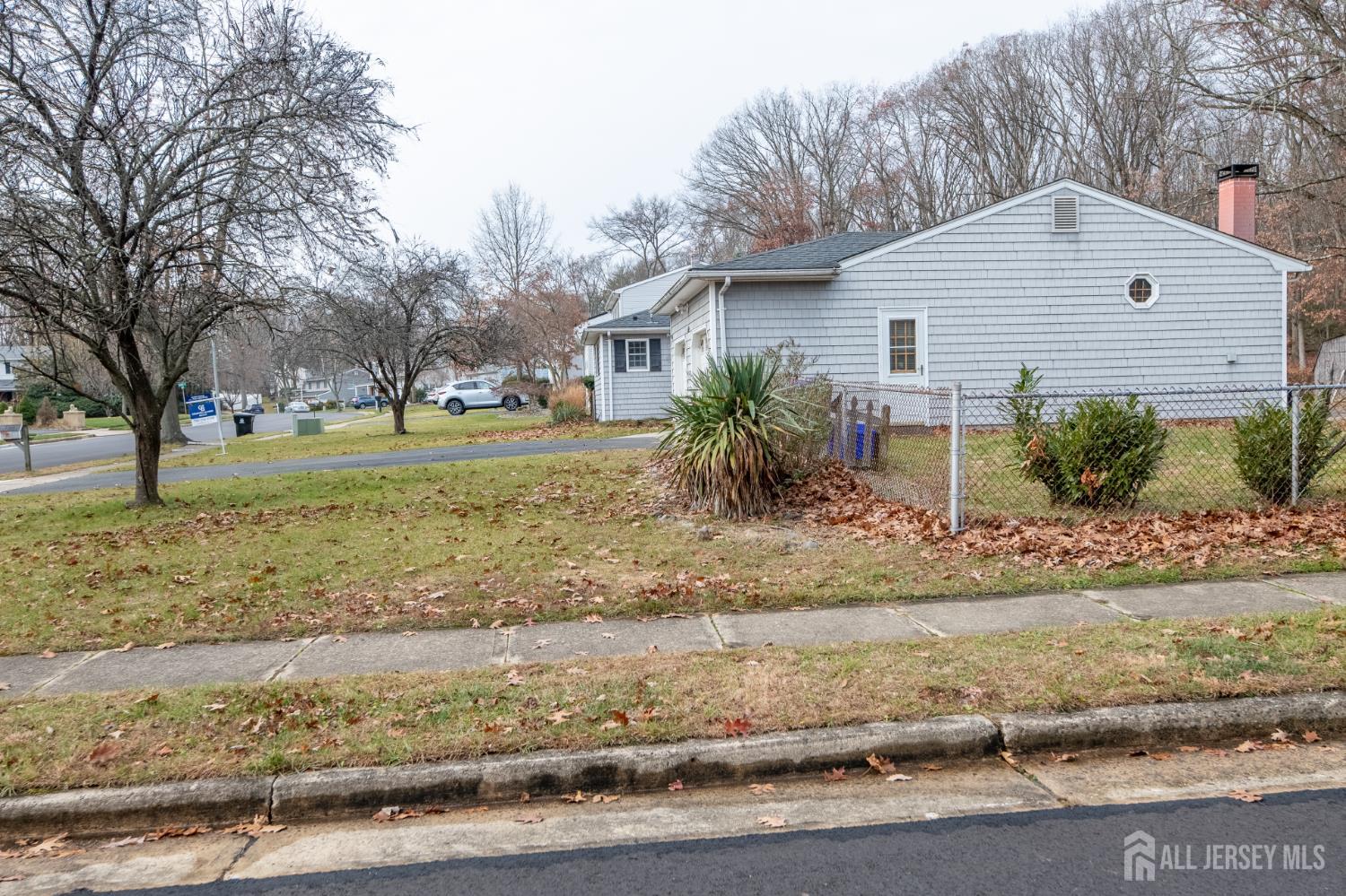 12 Francis Road East Brunswick, NJ 08816 - Photo 53 of 66 a front view of a house with a yard