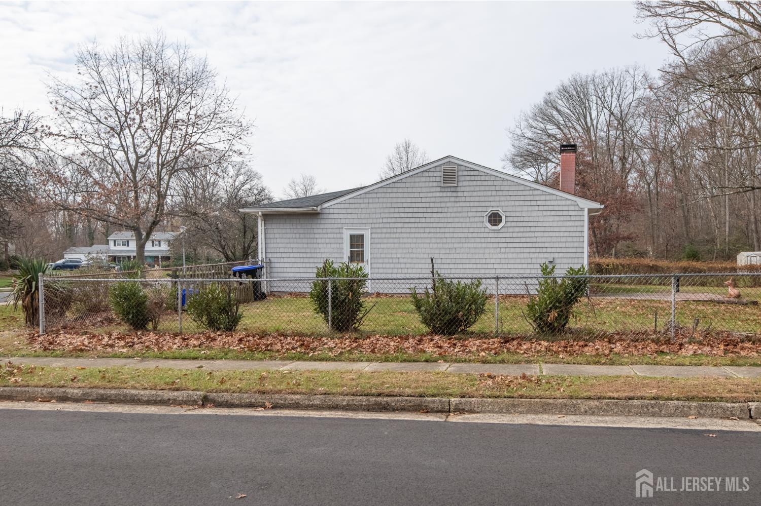 12 Francis Road East Brunswick, NJ 08816 - Photo 54 of 66 a front view of a house with a yard
