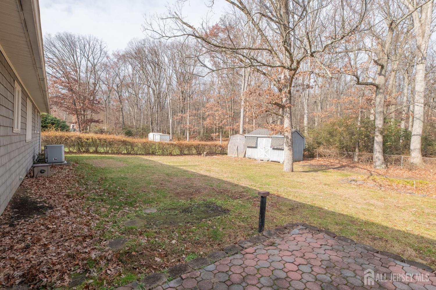 12 Francis Road East Brunswick, NJ 08816 - Photo 59 of 66 a view of a yard with wooden fence