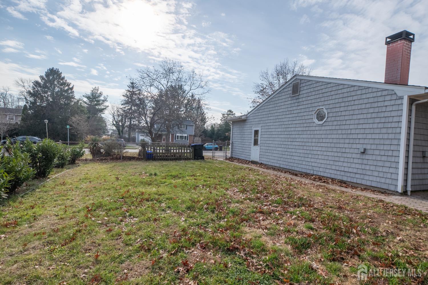 12 Francis Road East Brunswick, NJ 08816 - Photo 61 of 66 a backyard of a house with lots of green space