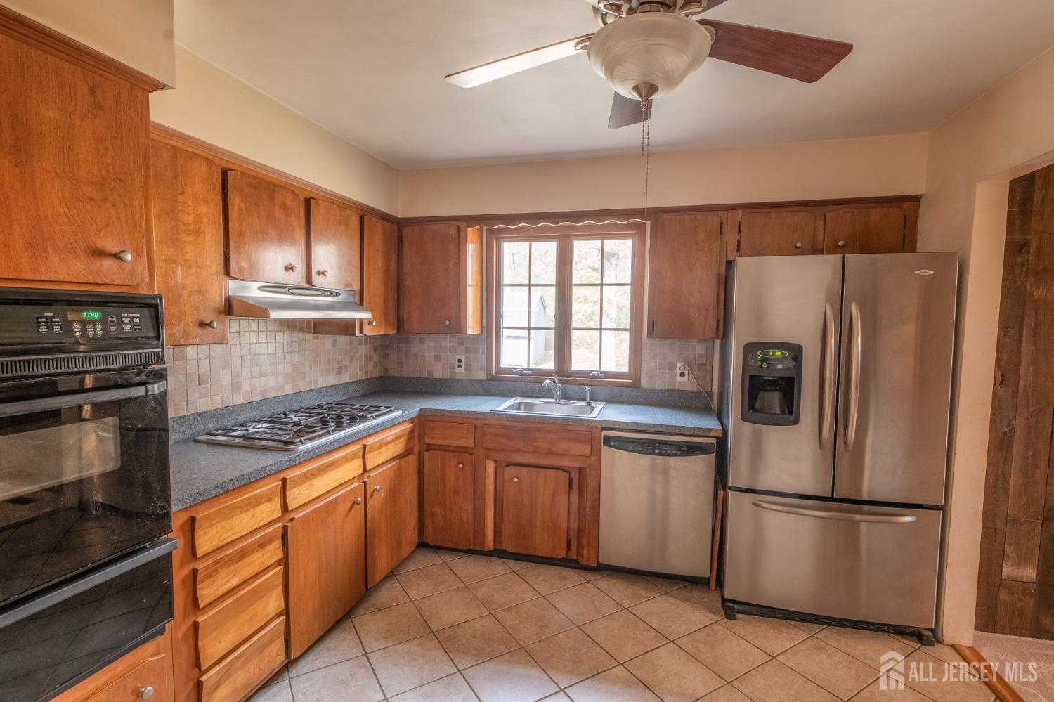 12 Francis Road East Brunswick, NJ 08816 - Photo 10 of 66 a kitchen with stainless steel appliances granite countertop a refrigerator sink and cabinets