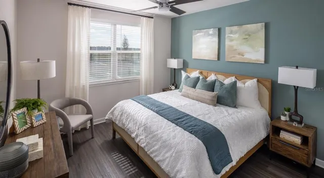 a bedroom with bed and a window