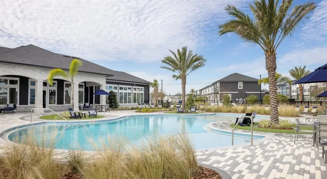 a view of a swimming pool with a lounge chairs