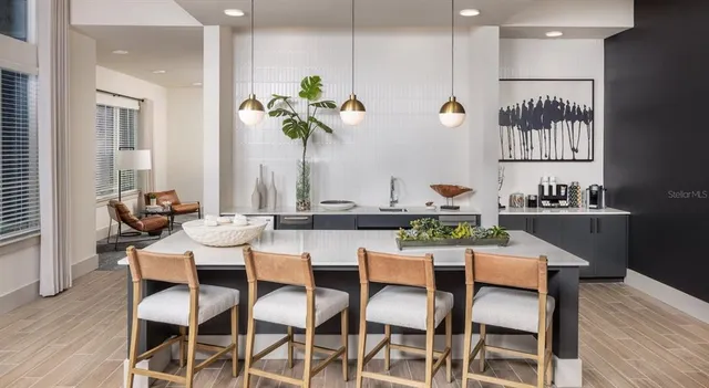 a dining room with furniture and wooden floor