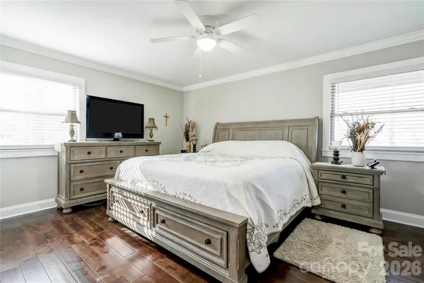 a bed room with a bed and a television