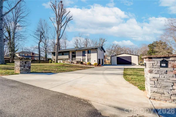 a view of multiple houses with a street
