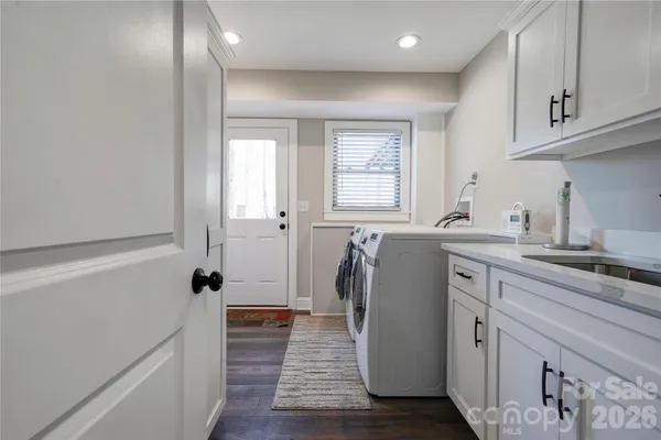 a kitchen with a refrigerator and a sink