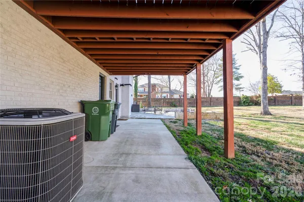 a view of balcony with wooden floor and outdoor seating
