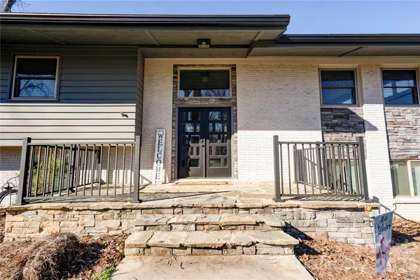 a front view of a house with a garage