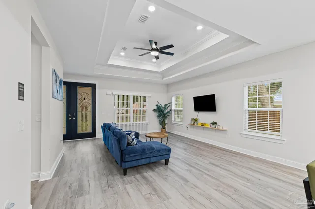a living room with furniture and a flat screen tv