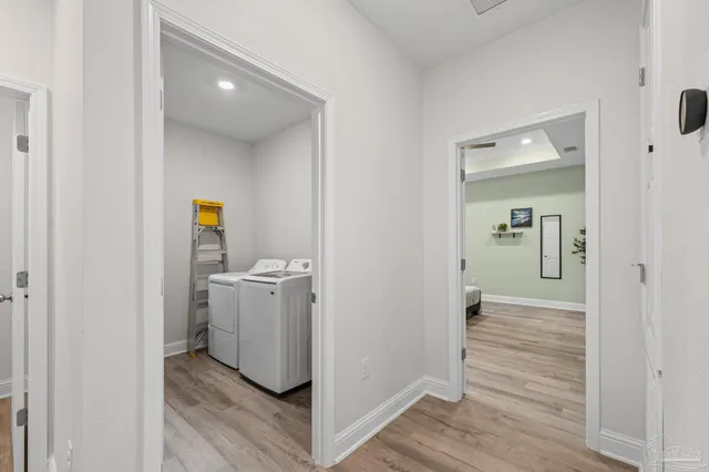 a kitchen with granite countertop a sink stainless steel appliances and white cabinets