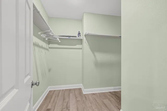 a bathroom with a granite countertop double vanity sinks and a mirror