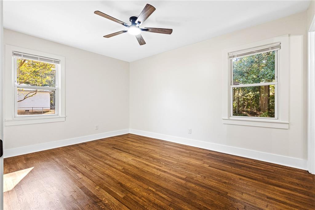 4976 Mable Lake Drive Southwest Mableton, GA 30126 - Photo 14 of 18 a view of empty room with wooden floor and fan