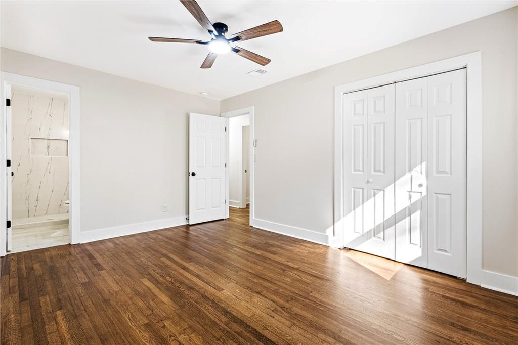 4976 Mable Lake Drive Southwest Mableton, GA 30126 - Photo 16 of 18 a view of an empty room with wooden floor