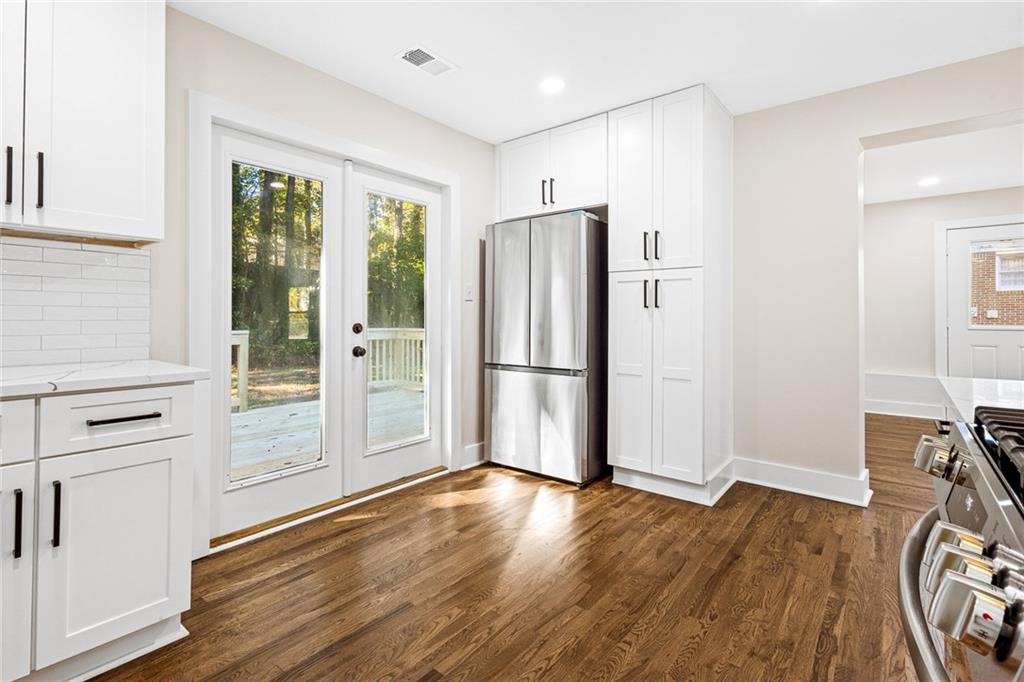 4976 Mable Lake Drive Southwest Mableton, GA 30126 - Photo 4 of 18 a view of kitchen with wooden floor and electronic appliances