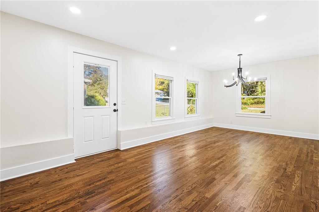 4976 Mable Lake Drive Southwest Mableton, GA 30126 - Photo 7 of 18 a view of an empty room with wooden floor and a window