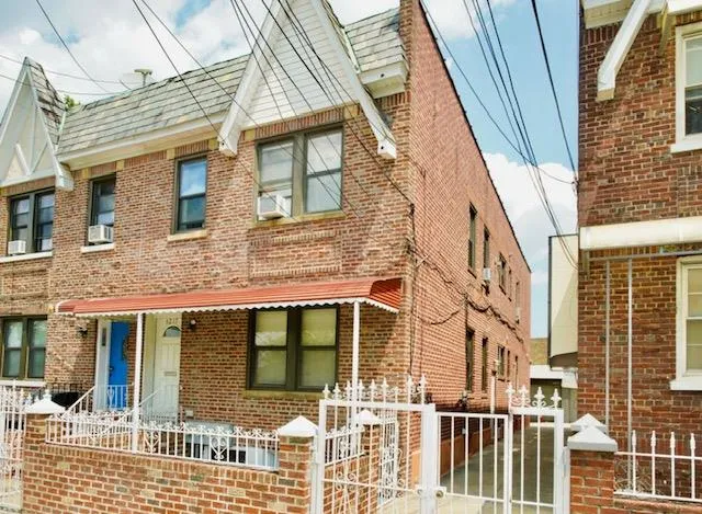 a view of a brick building next to a building