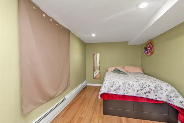 a bedroom with a bed and a dresser