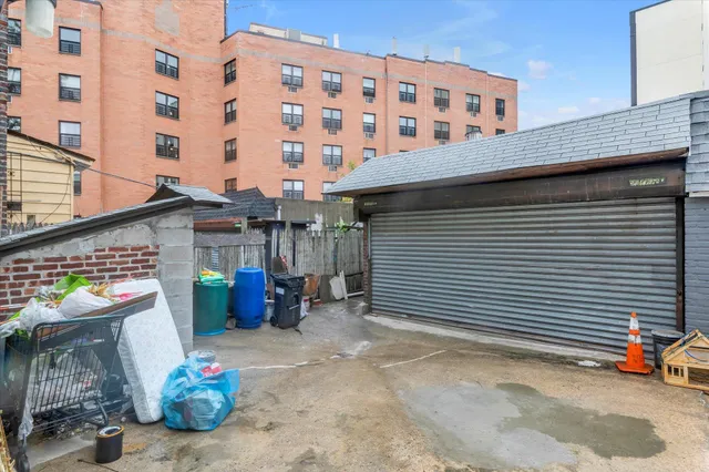 a front view of a building with seating space