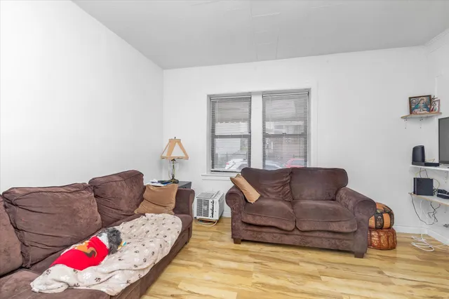 a living room with furniture window and couch