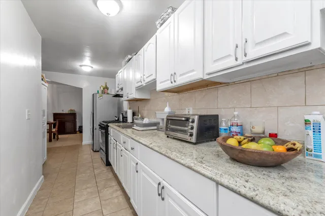 a kitchen with counter space cabinets and appliances