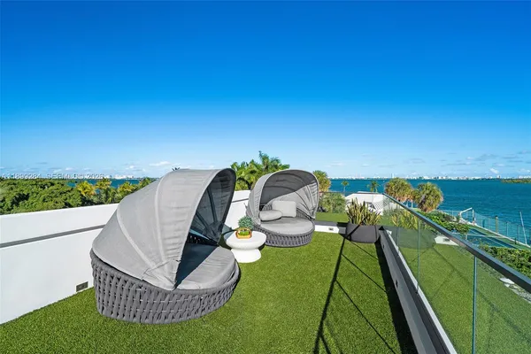 a view of a patio with couches chairs and a table and chairs