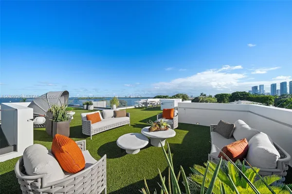a lobby with furniture and floor to ceiling window