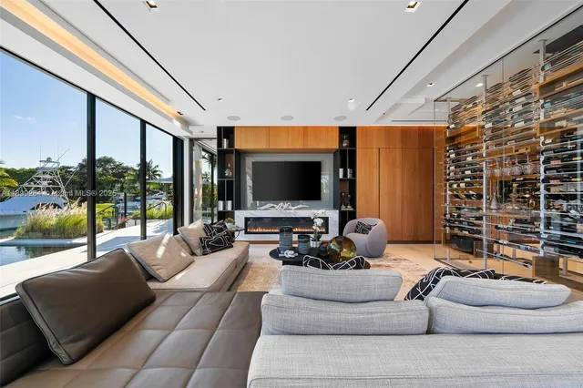 a living room with a couch and a floor to ceiling window