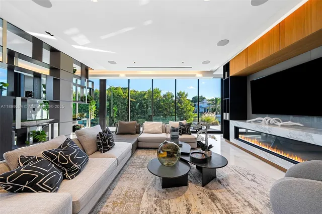 a bedroom with furniture and large windows