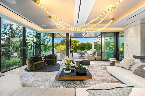 a living room with a couch and a potted plant