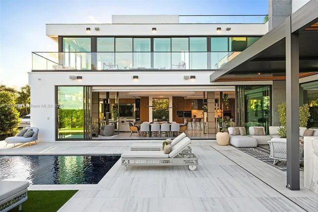 a lobby with furniture and floor to ceiling window