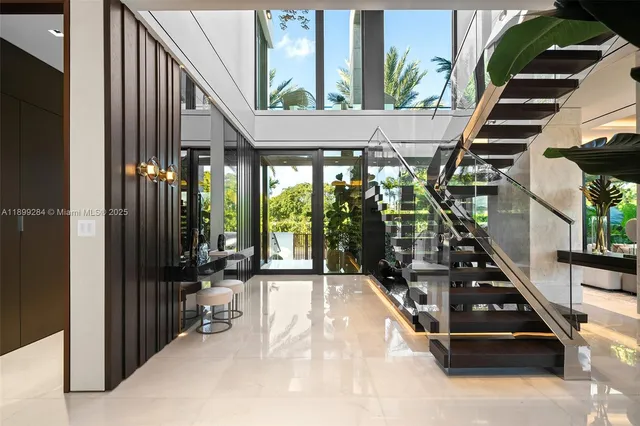 a large bedroom with a large bed and a flat screen tv