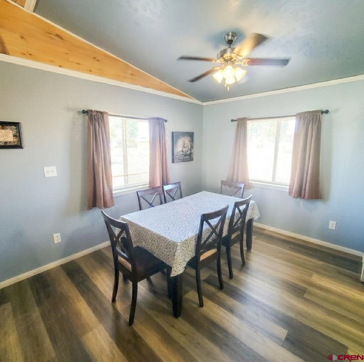 816 Main Street Manassa, CO 81141 - Photo 8 of 23 a view of a dining room with furniture window and wooden floor