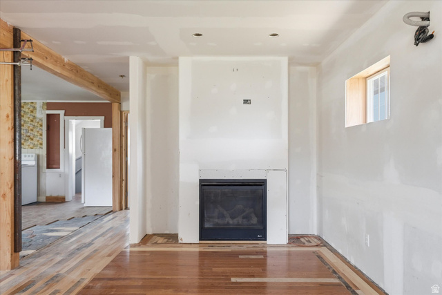 395 North 400 West Logan, UT 84321 - Photo 5 of 48 Room with partial wood-finish flooring and a built-in fireplace
