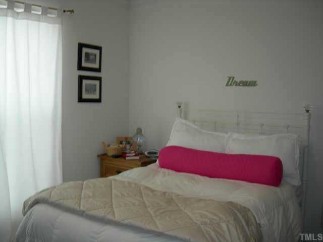 112 Fieldspring Lane Raleigh, NC 27606 - Photo 10 of 10 a bedroom with a bed and a closet