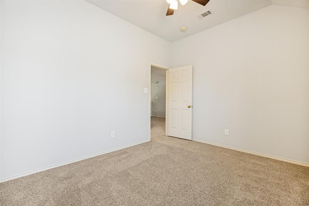 1215 Spring Creek Drive Allen, TX 75002 - Photo 26 of 40 Neutral-toned carpeting paired with light walls and white trim