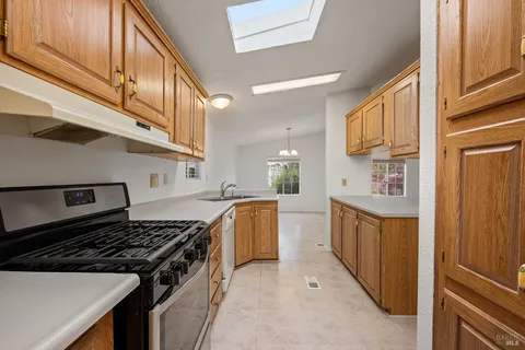 a kitchen with stainless steel appliances granite countertop a stove and a sink