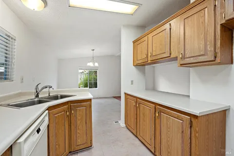 a kitchen with stainless steel appliances granite countertop a sink and dishwasher