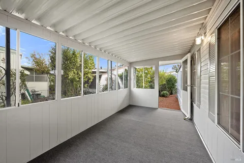 a view of a room with a large window