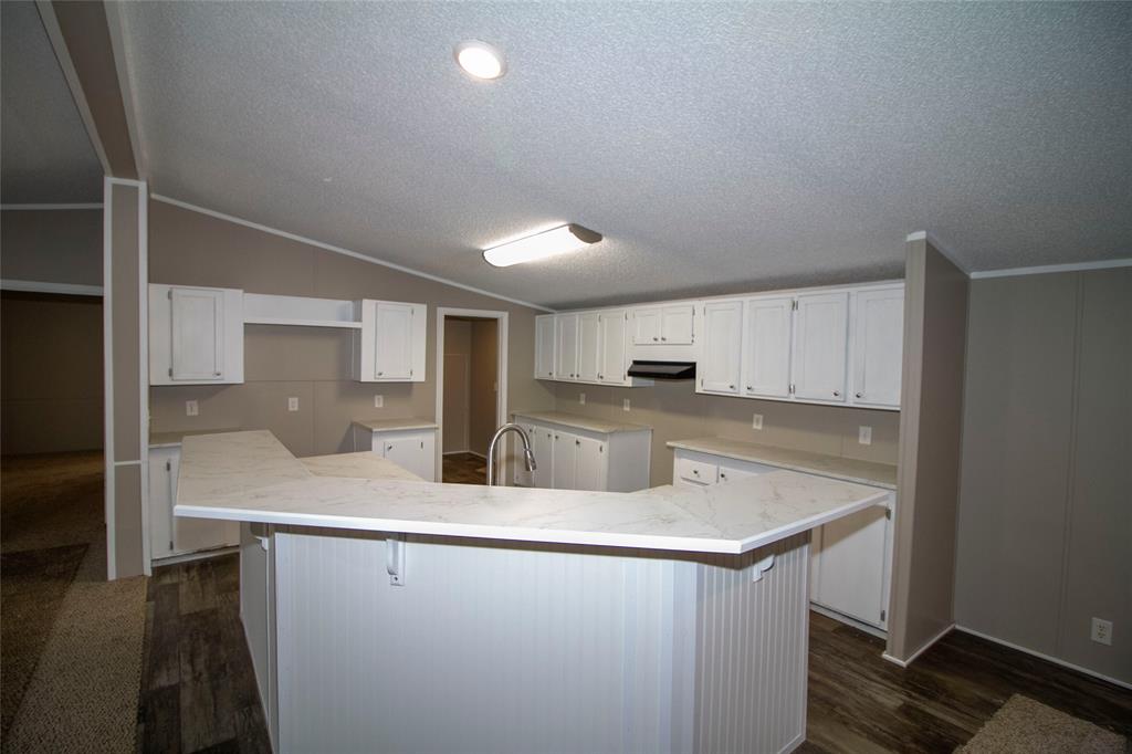 909 Old Arcadia Road Minden, LA 71055 - Photo 5 of 21 a kitchen with stainless steel appliances a sink stove and cabinets