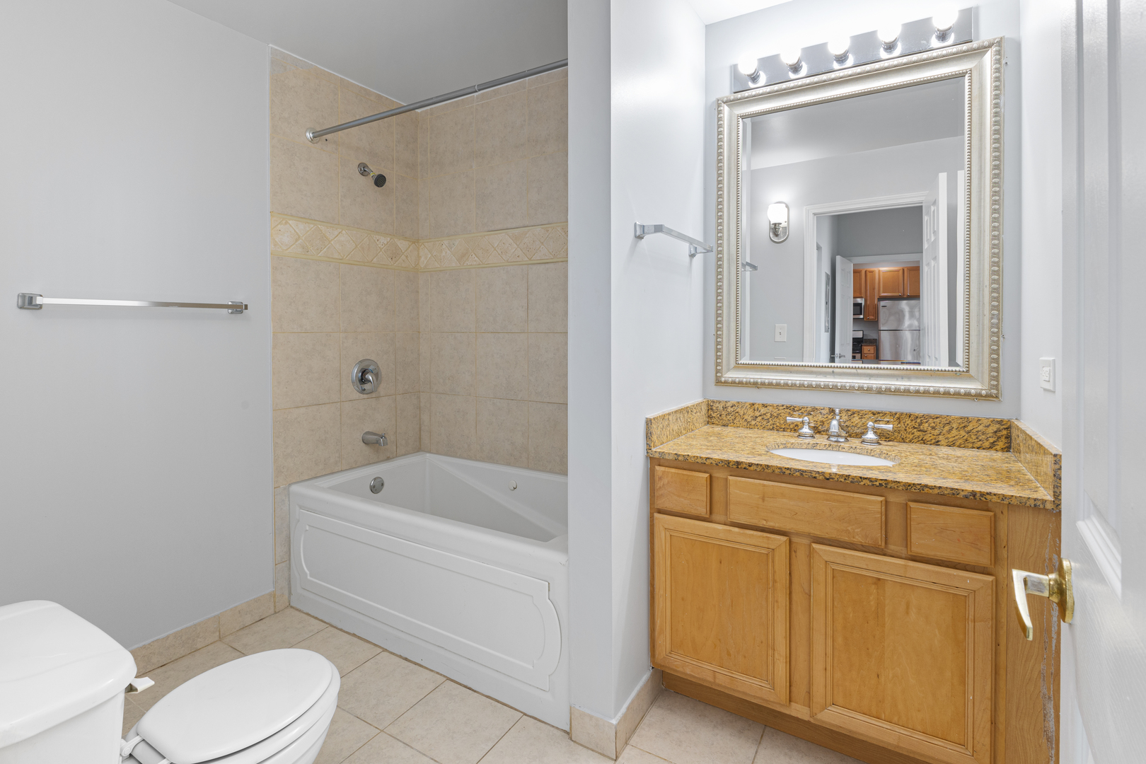 2451 West Howard Street, Unit 406 Chicago, IL 60645 - Photo 12 of 15 a bathroom with a sink a toilet and bathtub