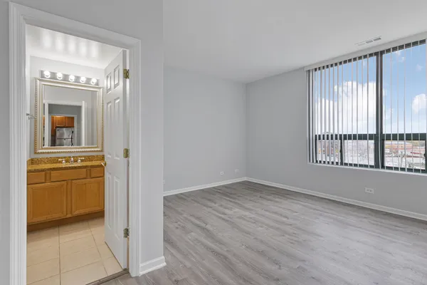 a view of a kitchen with an empty space and a window