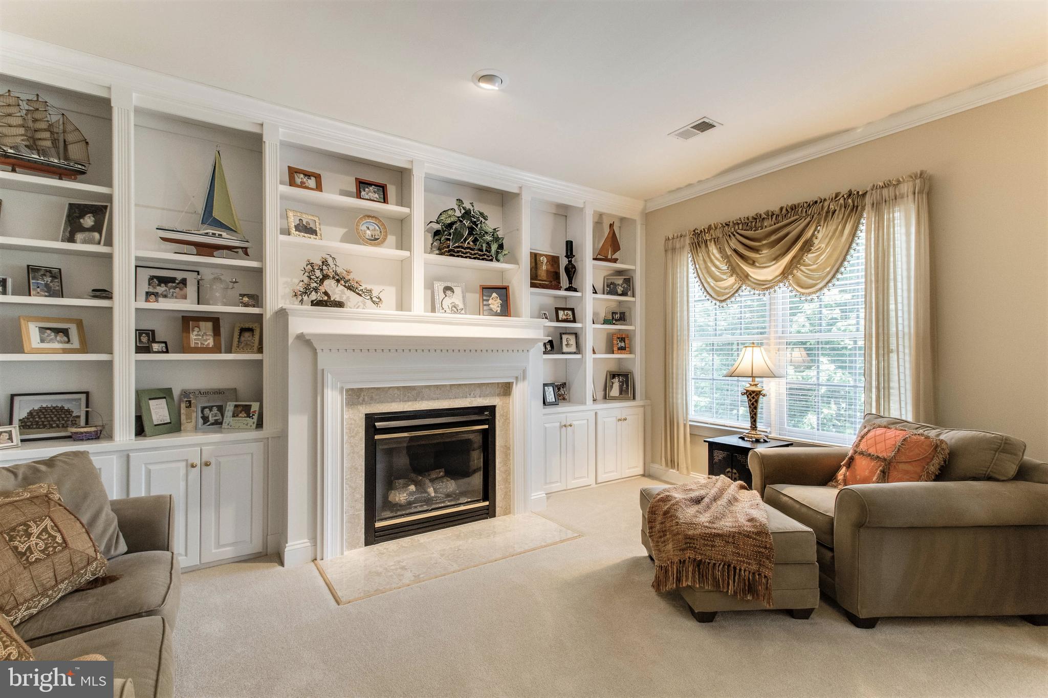 8314 Roxborough Loop Gainesville, VA 20155 - Photo 39 of 93 Cozy Sitting Room with Gas Fireplace